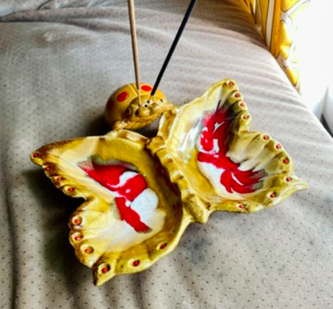 A close up shot of a ceramic mushroom incense burner